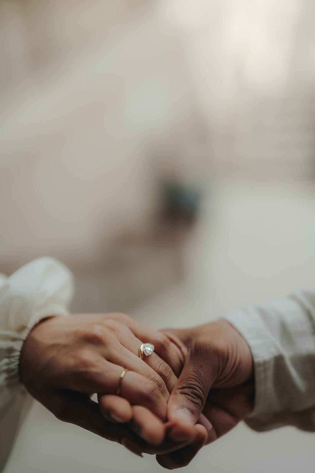 Editorial couple — ring detail from different angle