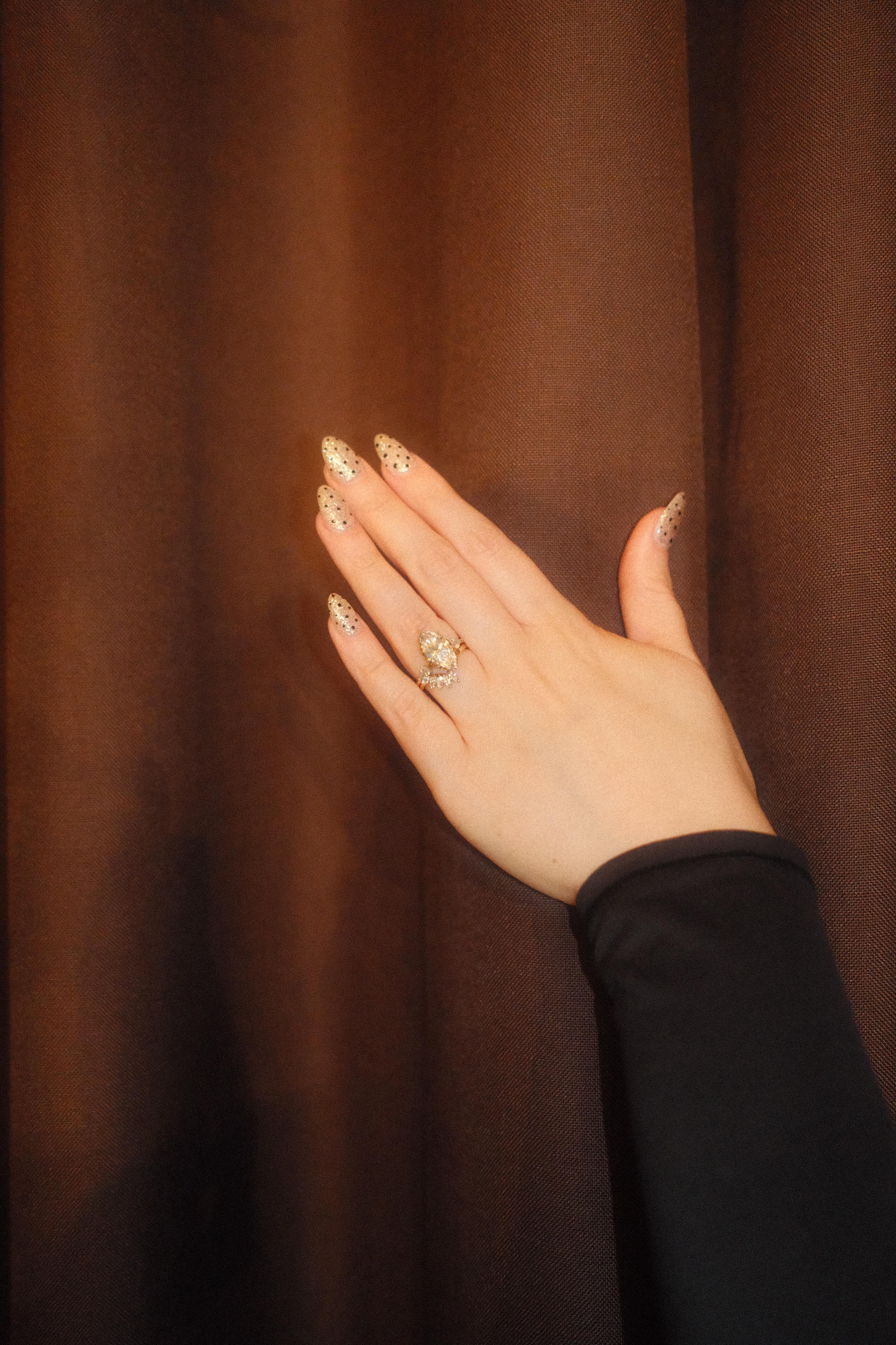 Editorial ring detail during golden-hour couple session